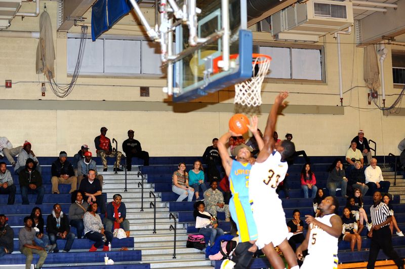 Seaford boys' basketball put an athletic team on the court last season, and the girls went to the Henlopen Conference Championship, losing to Smyrna. Here Andre Washington, right, goes after a shot of E.J.Fountain. But overall, programs are fading. Find Scotty from Meatland in the photo. BY DAVE FREDERICK